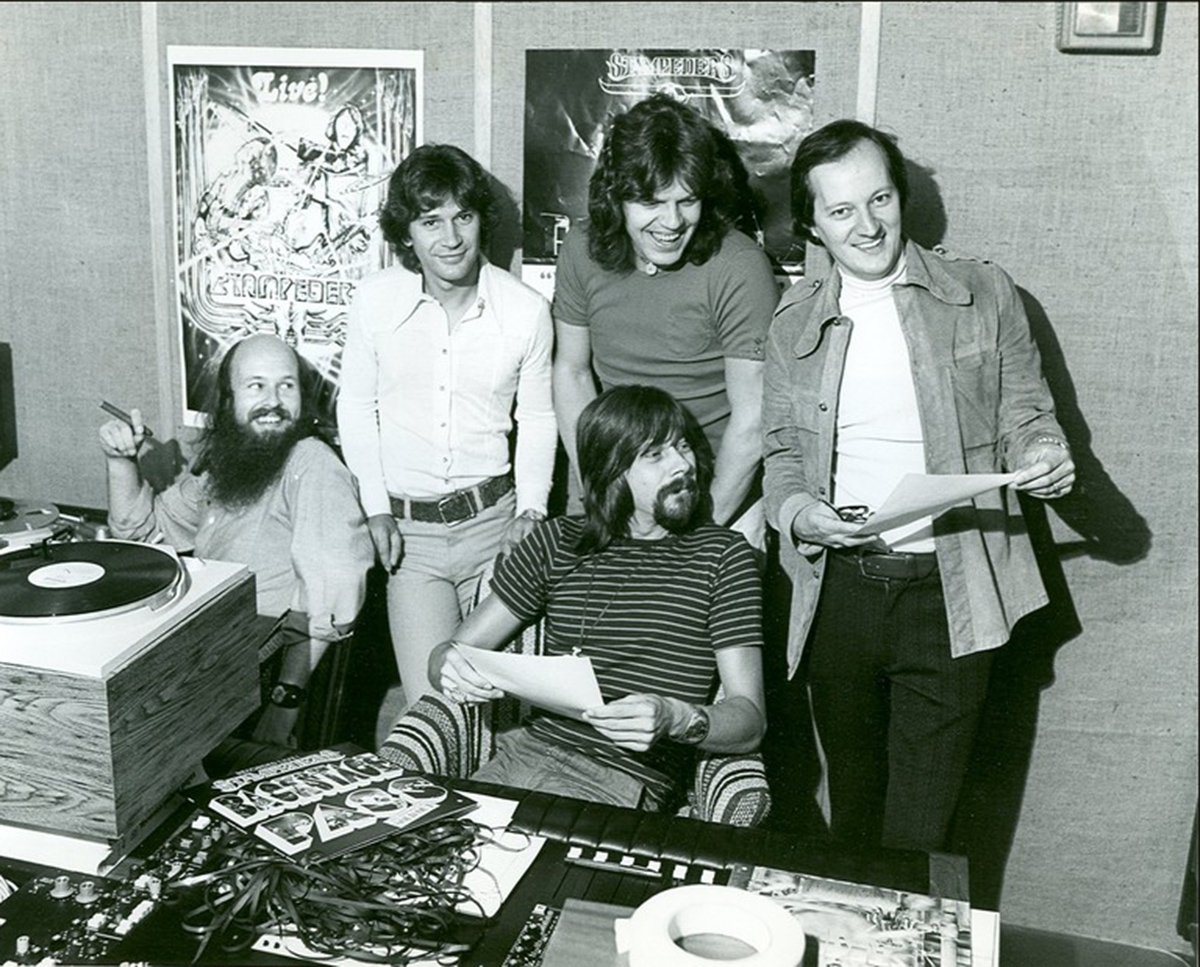 The Stampeders - Kim Berly and Ronnie King along with former manager Mel Shaw visit DJ Dave Mickey (seated) for a radio interview in 1973